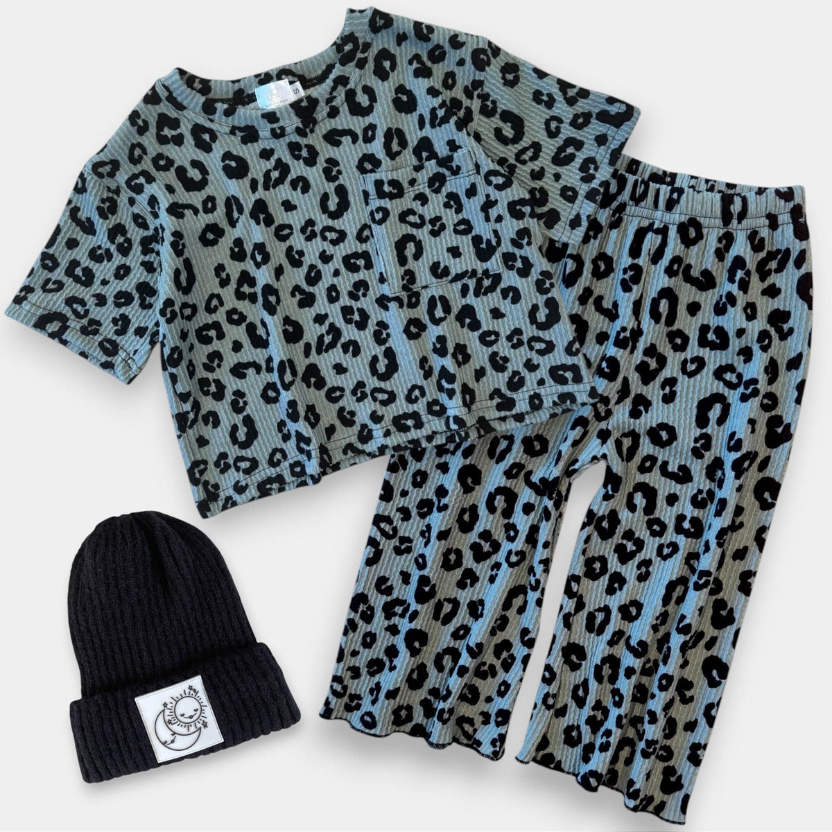 Matching Ch-Ch-Ch-Cheetah tee and wide leg pant with a black beanie, laid flat