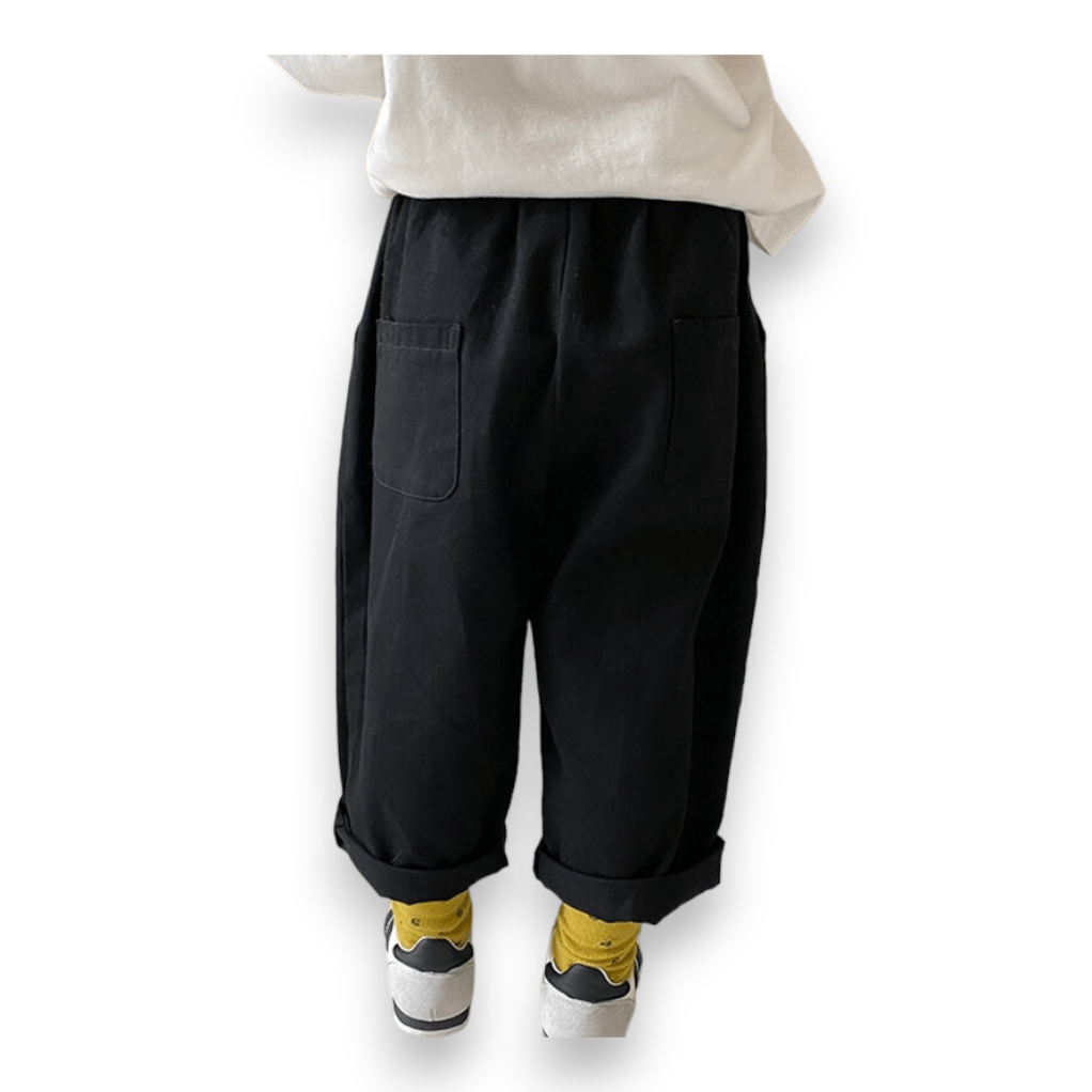 City Kid Baggy Pant in black, worn cuffed, back view showing the two back pockets