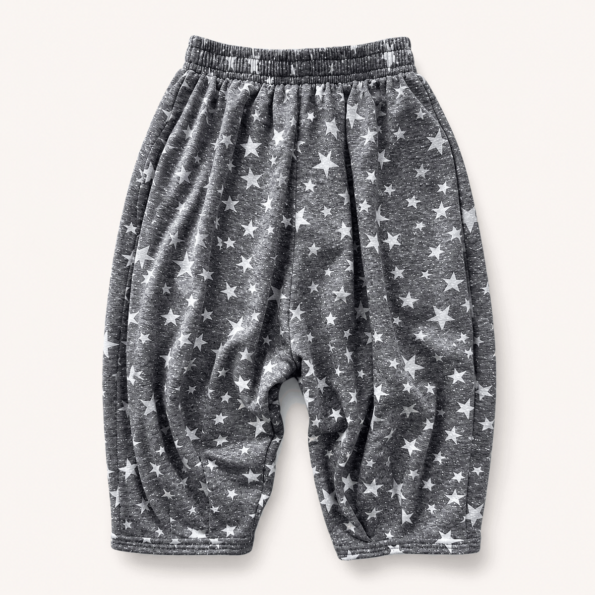 Rockstar Hammer Pant, charcoal with an allover white burnout star print, laid flat