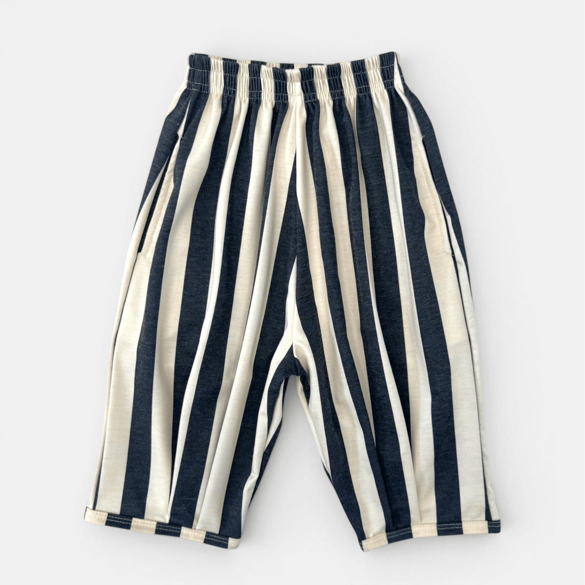 Jester Balloon Pant, charcoal and cream vertical stripes, laid flat
