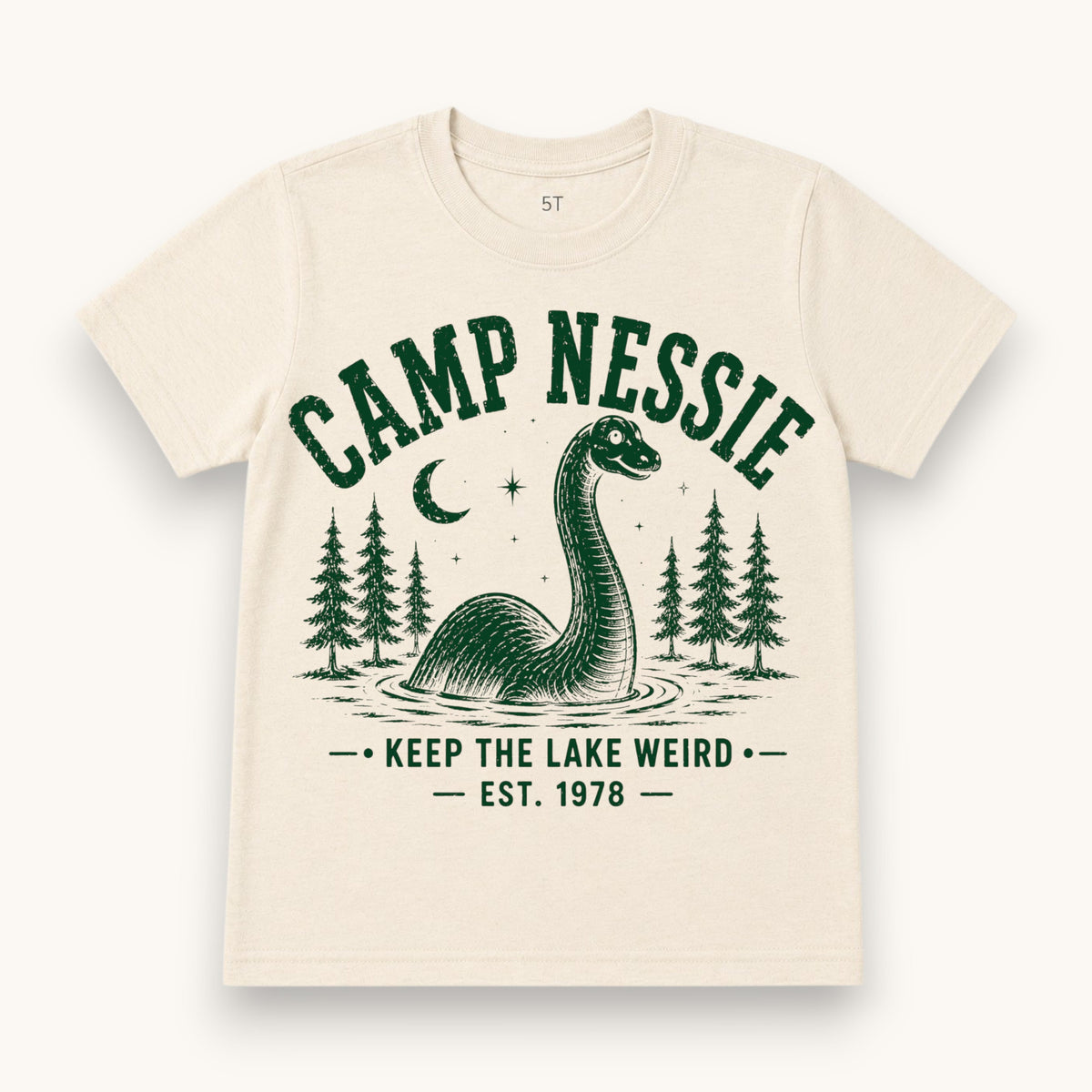 Camp Nessie Vintage Tee, cream with a green lake monster and pine trees graphic
