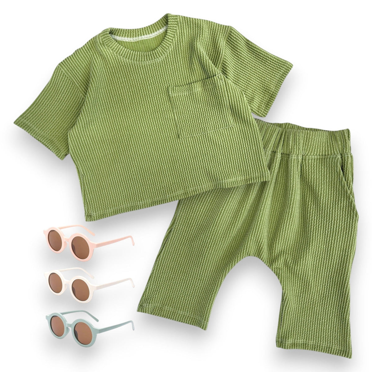 Groovy Green pocket tee and harem short set with sunglasses, laid flat