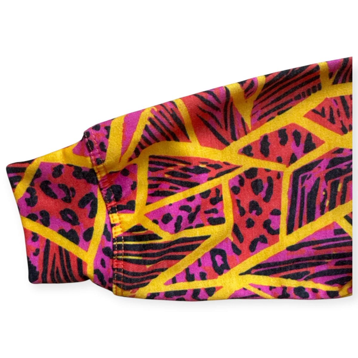 Close-up of the Neon Jungle print at the pullover cuff