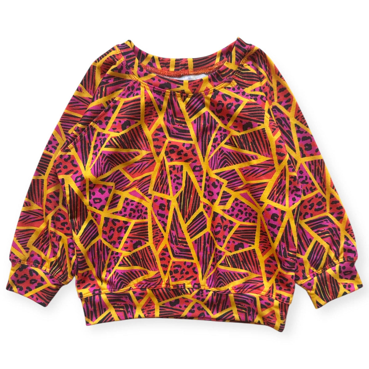 Neon Jungle Pullover, magenta and orange geometric print with animal spots, laid flat
