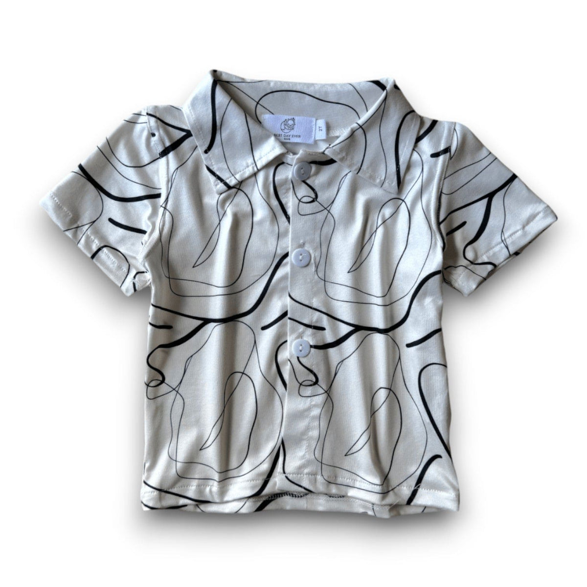Snazzy Button Down in the Scribbles print, cream with black abstract line art, laid flat