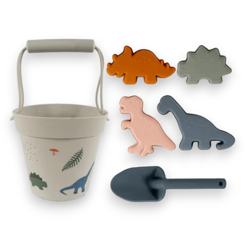 Dinosaur print silicone beach set with dinosaur molds and a blue shovel