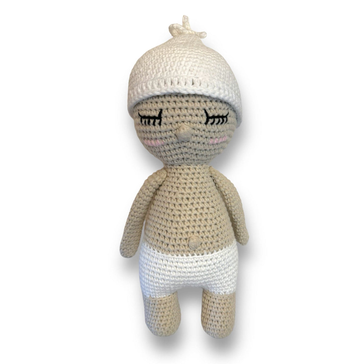 Hand-crocheted baby doll with light skin and a cream knit hat