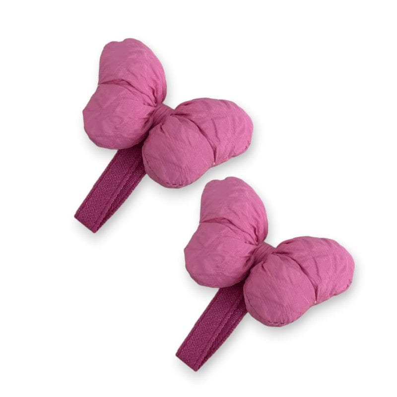 Two puffy magenta bow hair clips