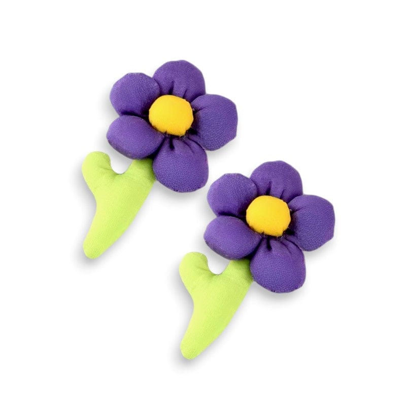 Two plush purple flower hair clips with yellow centers