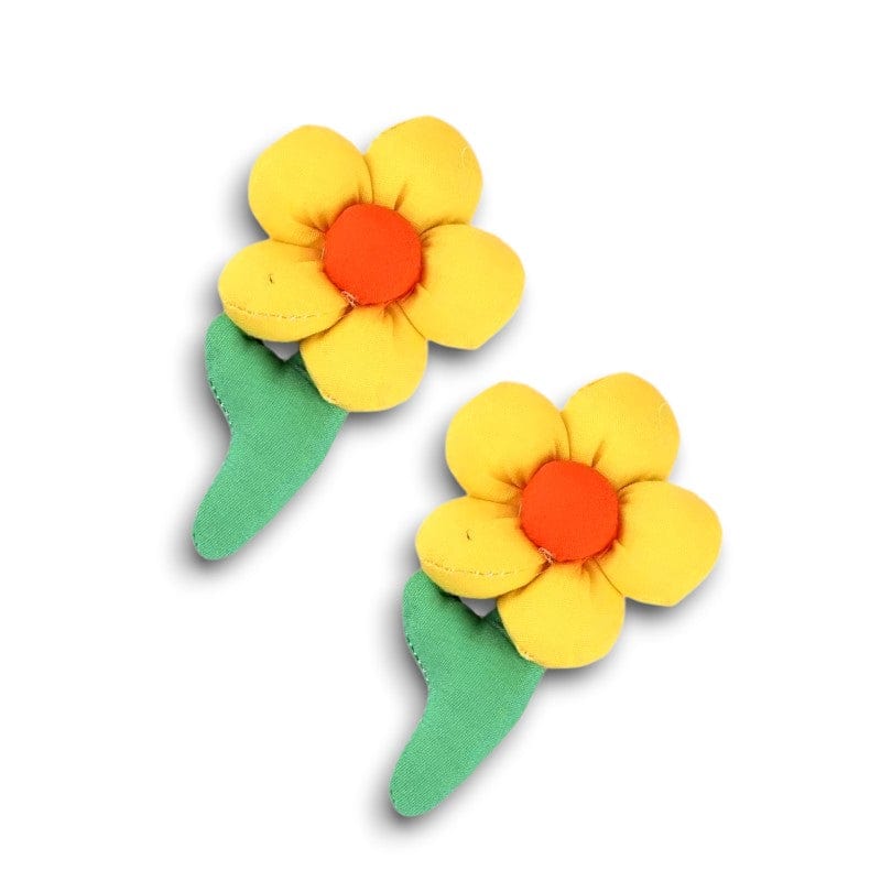 Two plush yellow flower hair clips with orange centers
