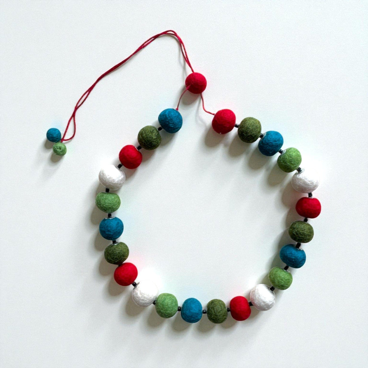Felt bead necklace in red, teal, green and white