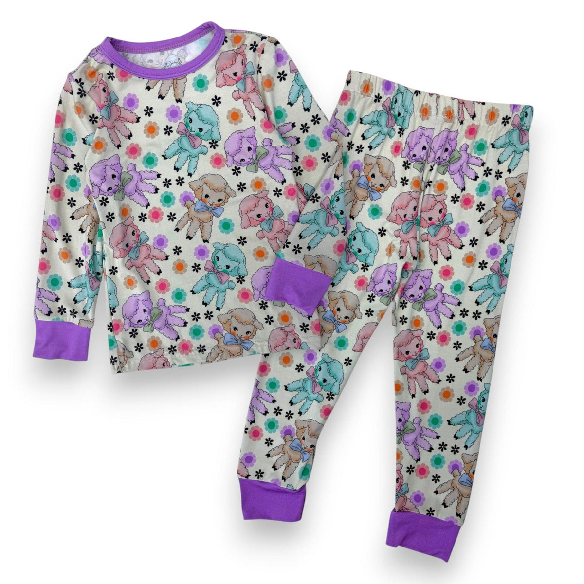 Bow Peep PJ Set with pastel lambs and flowers and lavender cuffs, laid flat