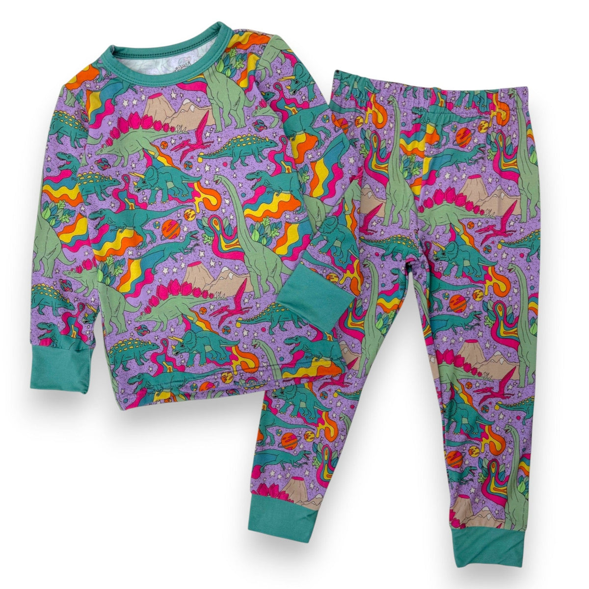 Groovy Saurus PJ Set with dinosaurs and lava swirls on lavender, laid flat
