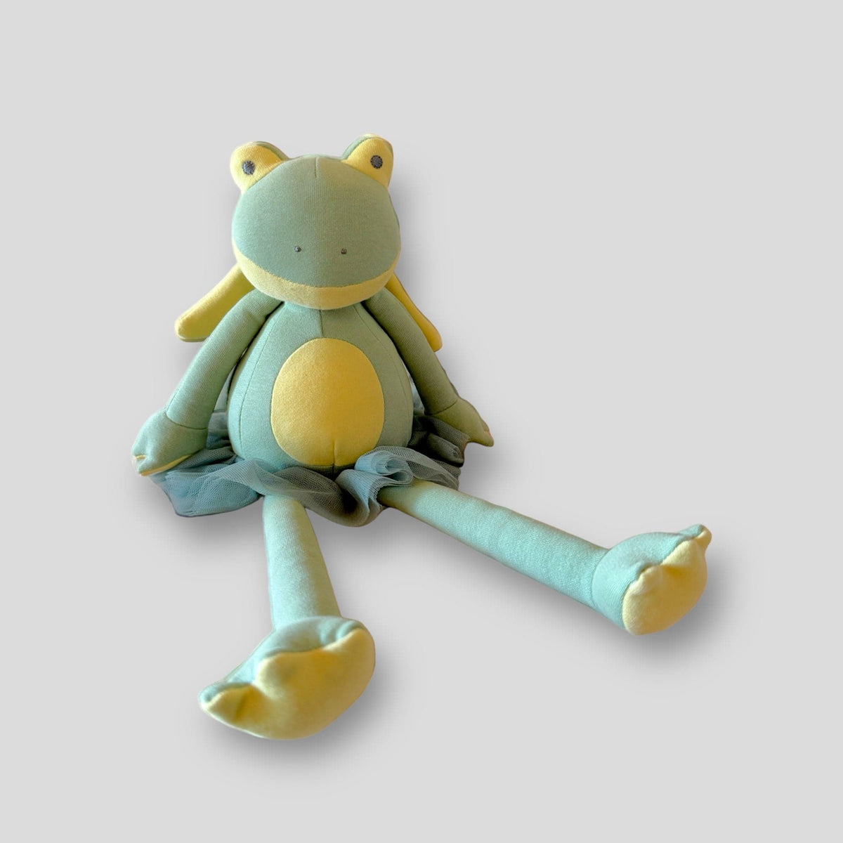 Gladys the Frog Fairy, a green frog plush with a yellow belly and long legs