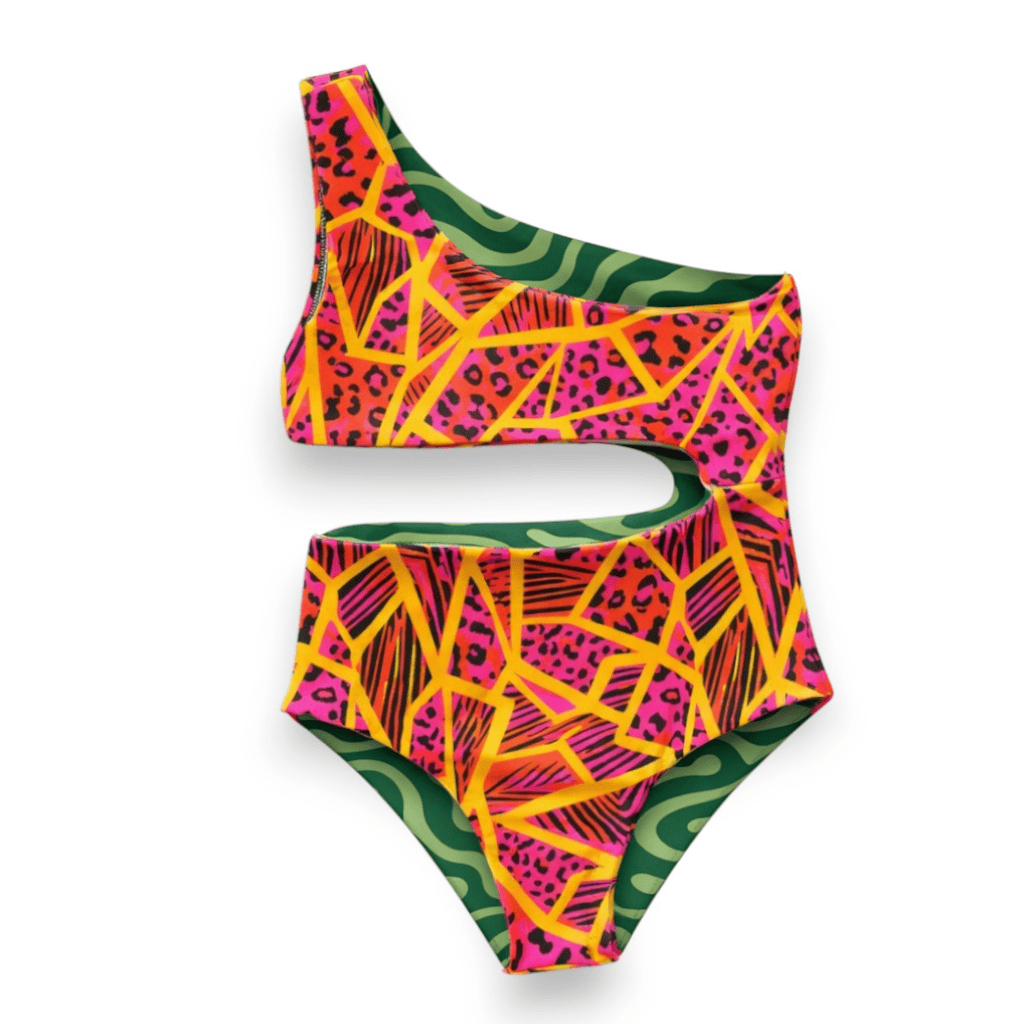 Flipside Reversible Swimsuit, Neon Jungle side: magenta and orange geometric print, one-shoulder cutout