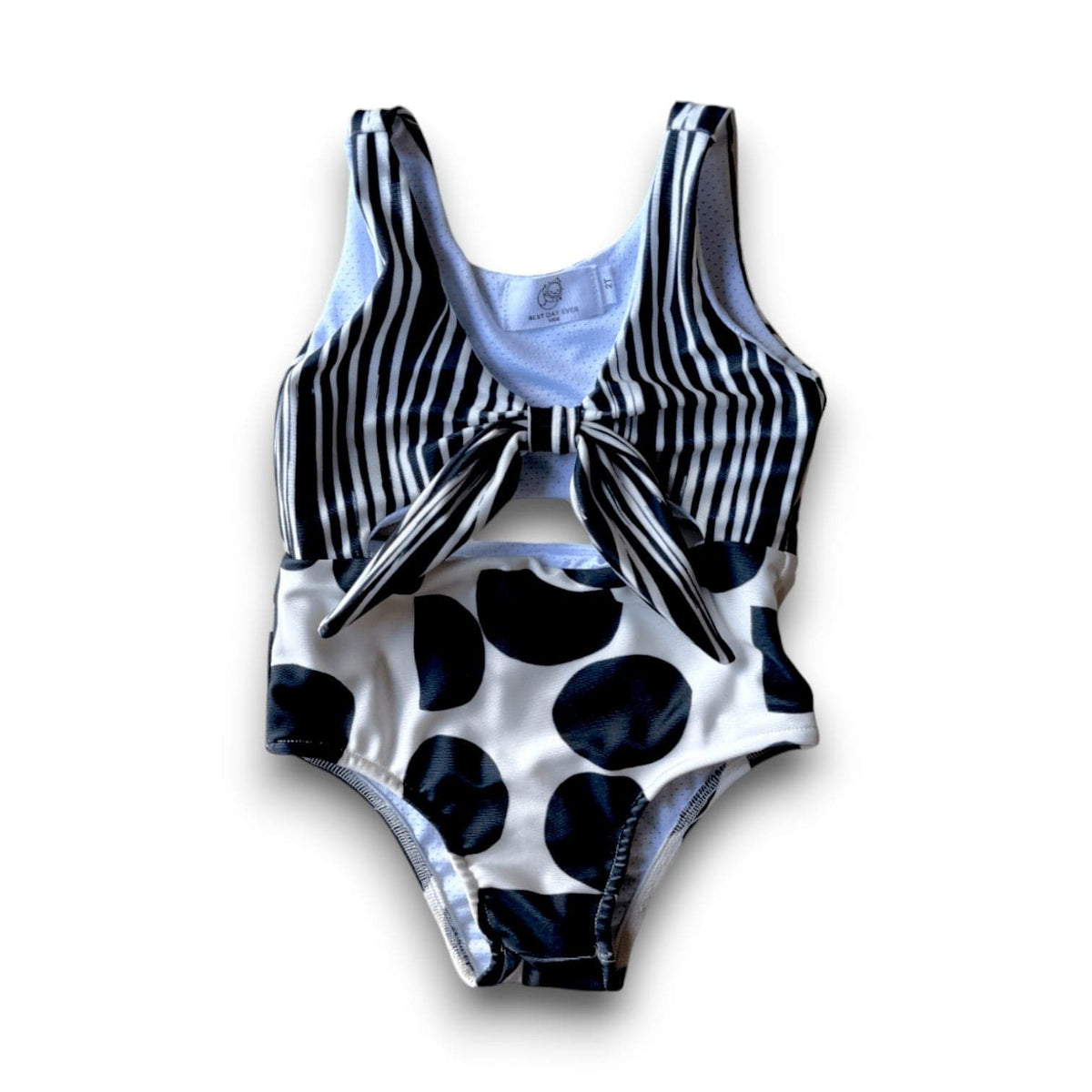 Pop and Stripes Swimsuit with a black-and-white striped top and large-dot bottom, back view