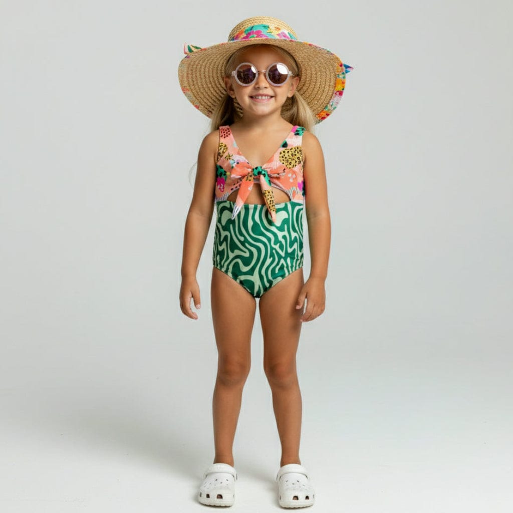 Kid in a straw hat and sunglasses wearing the Radical Remix Swimsuit