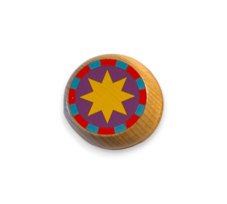 Wooden yo-yo with a yellow star on purple, top view