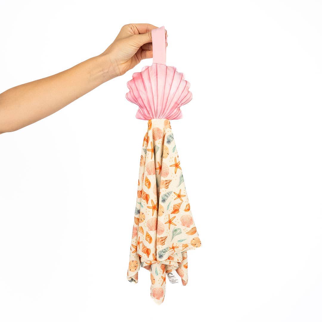 Seashell lovey held up by its loop
