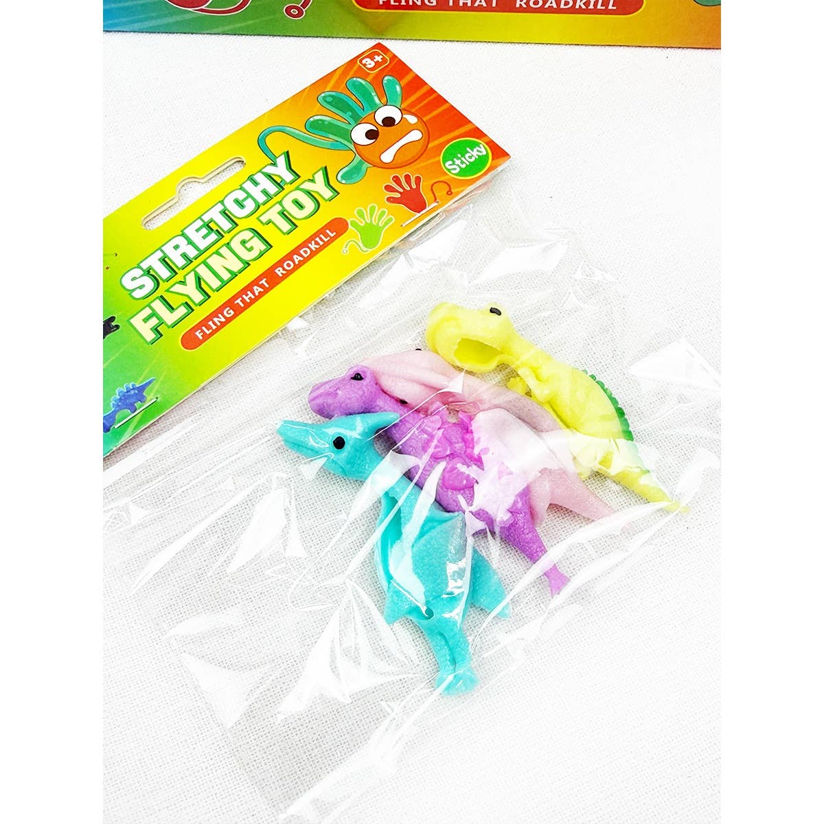 Stretchy flying dinosaur toys in their package