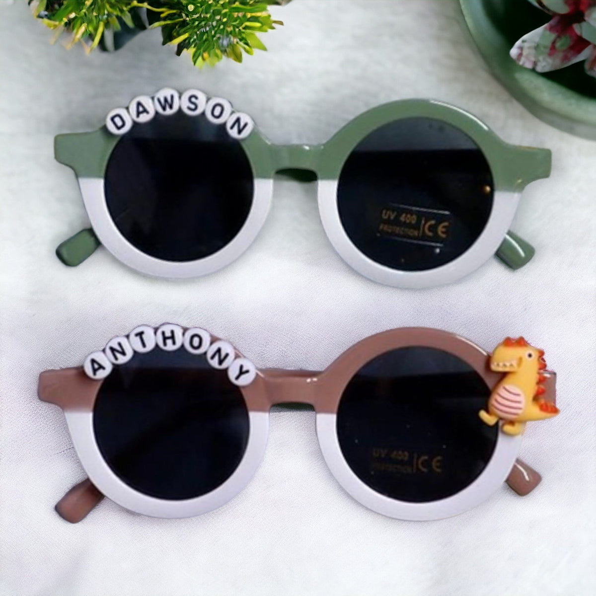 Green and brown two-tone personalized sunglasses with names Dawson and Anthony