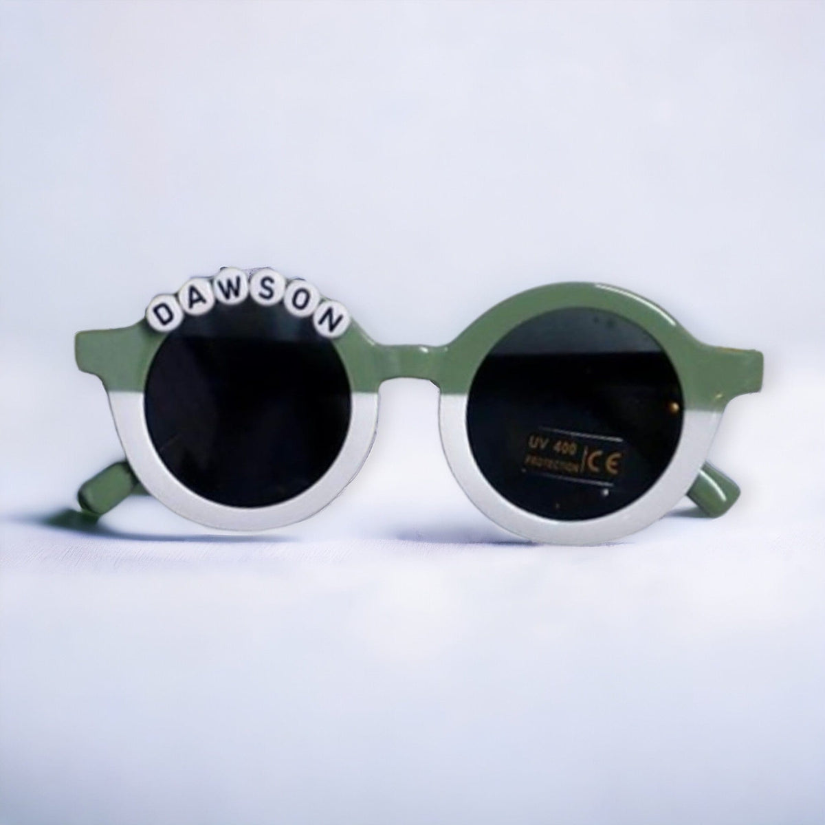 Green and white sunglasses personalized with the name Dawson
