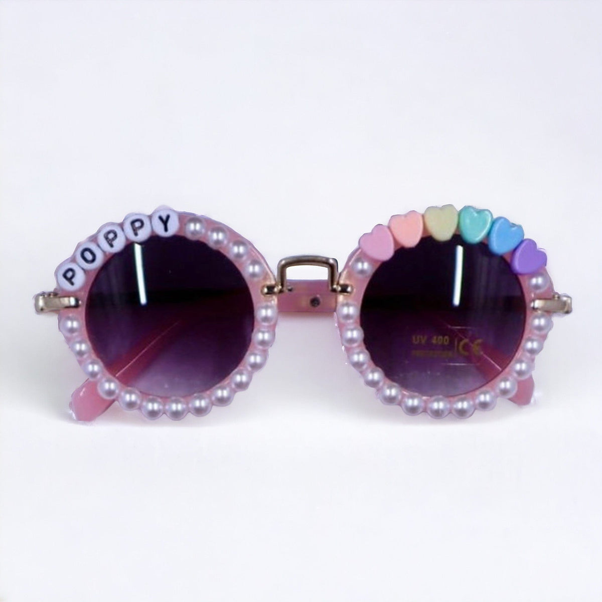 Pink pearl-trimmed sunglasses personalized with the name Poppy